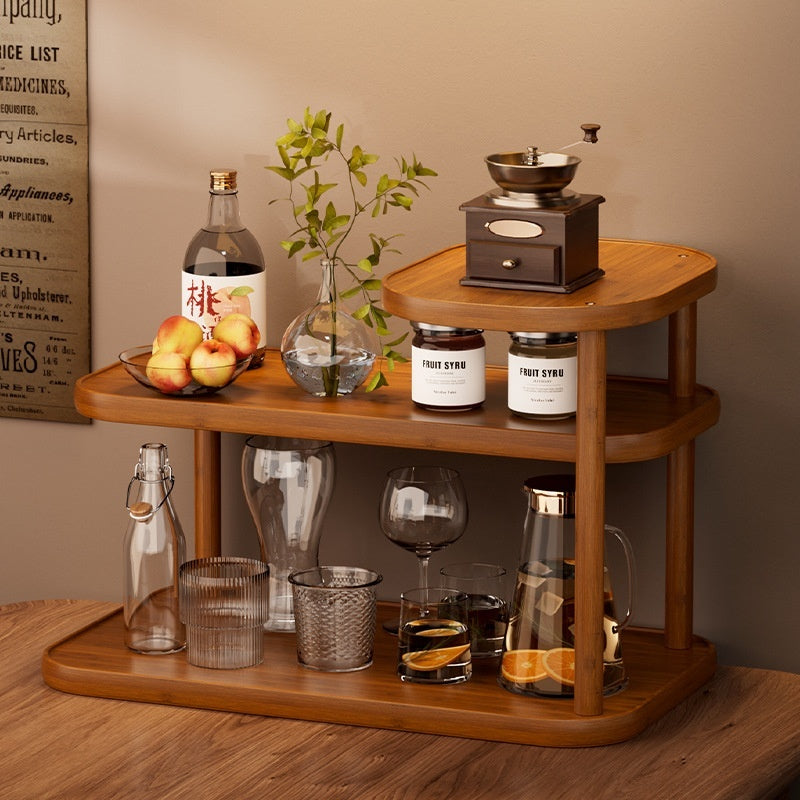 Three-tier coffee corner shelf with a hand grinder, syrup jars and glassware