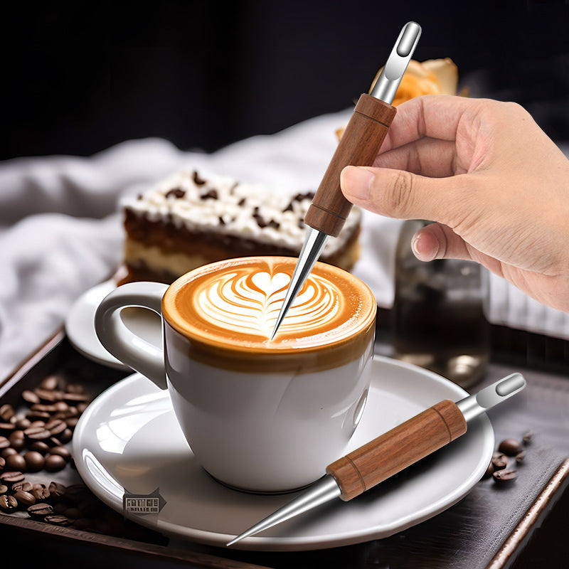 Rosewood latte art needle resting on a saucer beside a coffee cup