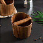 Acacia knock box showing the cut-away rim that clears a portafilter spout