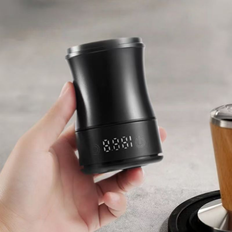 Close-up of the touch controls and LED scale on the matte black dosing cup