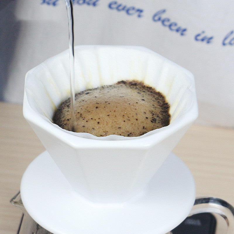 Pour-over brewing in the octagonal ceramic dripper over a glass carafe
