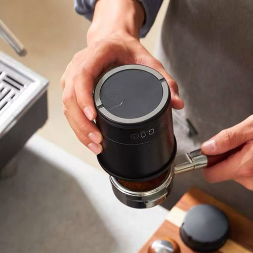 Matte black dosing cup with built-in LED scale display reading 0.0 grams