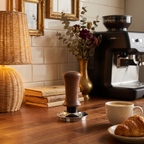 Walnut Calibrated Espresso Tamper on a home coffee bar — warm walnut handle and stainless base on a cozy espresso corner counter